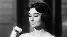 Audrey Hepburn Love In The Afternoon GIF - Audrey Hepburn Love In The Afternoon Smell GIFs