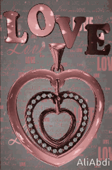 a heart shaped pendant with the word love written above it