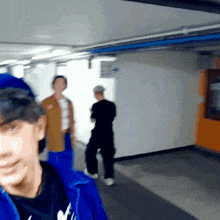a blurry photo of a man in a blue jacket