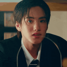 a close up of a person 's face with a gif that says phatatomaxgif