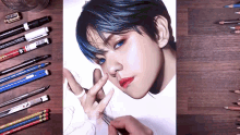 a drawing of a boy with blue hair is being created