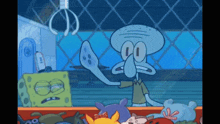 a cartoon of squidward from spongebob squarepants reaching for a toy