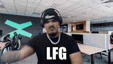 a man wearing headphones and a necklace says lfg