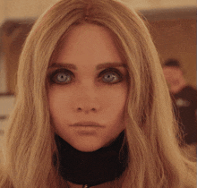 a woman with blonde hair and blue eyes is wearing a black choker around her neck