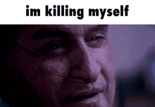 a close up of a man 's face with the words im killing myself