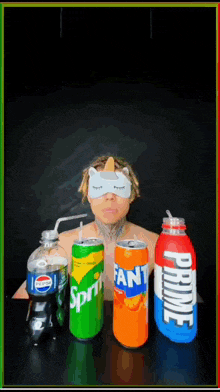 a man wearing a cat mask is surrounded by sprite fanta and pepsi cans