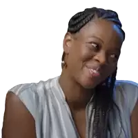 a woman with braids is smiling and looking up