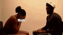 a man and a woman are sitting next to each other on a couch .