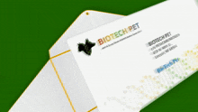 a white envelope with a business card inside