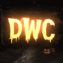 a sign that says dwc is lit up in a dark room
