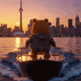a teddy bear is riding a boat in the water