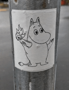 a sticker of a cartoon character holding a torch