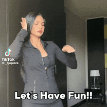 a woman dancing with the words let 's have fun on the bottom