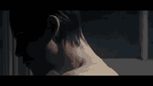 a close up of a person 's neck and shoulder