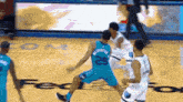 a basketball player with the number 25 on his jersey dribbles the ball