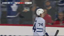 a hockey player with the number 74 on their jersey