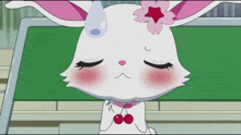 a cartoon rabbit with a cherry on its ear
