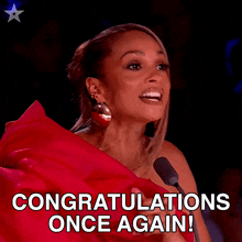 a woman in a red dress is speaking into a microphone and says congratulations once again