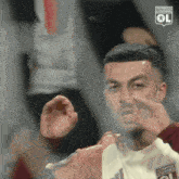 a soccer player with olympique lyonnais written on his jersey