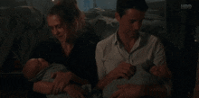 A Discovery Of Witches Holding Babies GIF - A Discovery Of Witches Holding Babies Twins GIFs