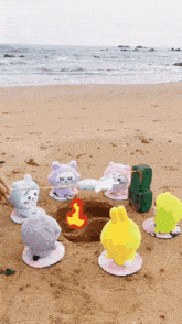 stuffed animals are roasting marshmallows on the beach