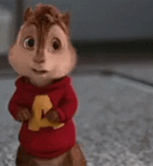 alvin the chipmunk from the alvin and the chipmunks is standing on a carpet .