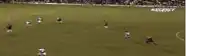 a blurry picture of a soccer game with the letters kzst on the bottom right