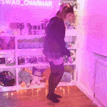 a girl is standing in front of a shelf full of stuffed animals and a sign that says swag charmar