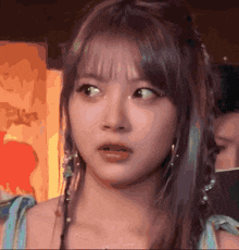 a girl with a surprised look on her face