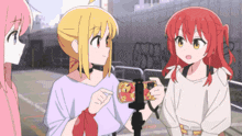 three anime girls are standing next to each other with one holding a camera
