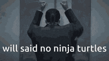 a man in a suit is standing in front of a door with the words will said no ninja turtles written below him
