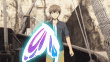 a man stands in front of a butterfly that is glowing in the dark