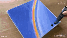 a painting of a rainbow is being painted with sap green burnt umber