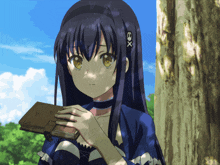a girl with a x on her head holds a book in her hand