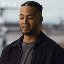 a close up of a man 's face with the words skymed written above him