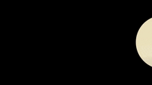 a man in a suit is standing in the middle of a circular object