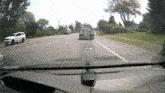 a dash cam shows a truck driving down a highway with the time of 13:53