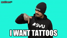 a man wearing a hoodie that says " i want tattoos "