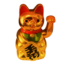 a golden statue of a cat with a red collar