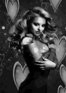 a black and white photo of a woman with a butterfly on her chest