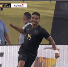 a soccer player with the number 19 on his shirt