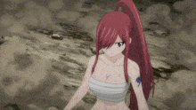 a girl with red hair is wearing a white bandage around her chest