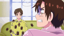 two anime characters are sitting on a couch and one of them is wearing a yellow shirt with ants on it