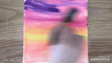 a painting of a sunset with the words made in animatica on the bottom