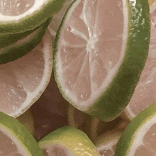 a bunch of sliced limes are stacked together