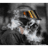 a person wearing a motorcycle helmet is covered in smoke