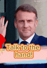 a picture of a man with the words talk to the hand on the bottom