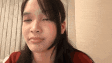 a close up of a woman 's face with her eyes closed and her mouth open