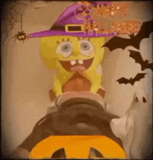 spongebob squarepants is wearing a witch hat and holding a pumpkin .