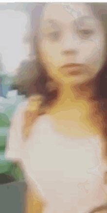 a blurry picture of a woman 's face with her eyes closed